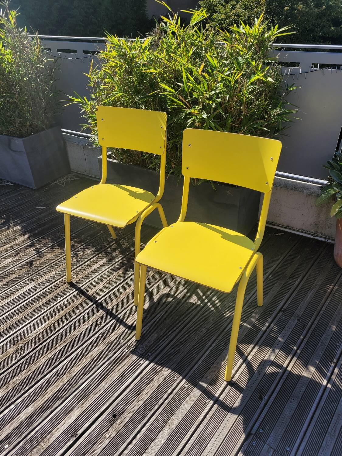 Pair of yellow plywood chairs