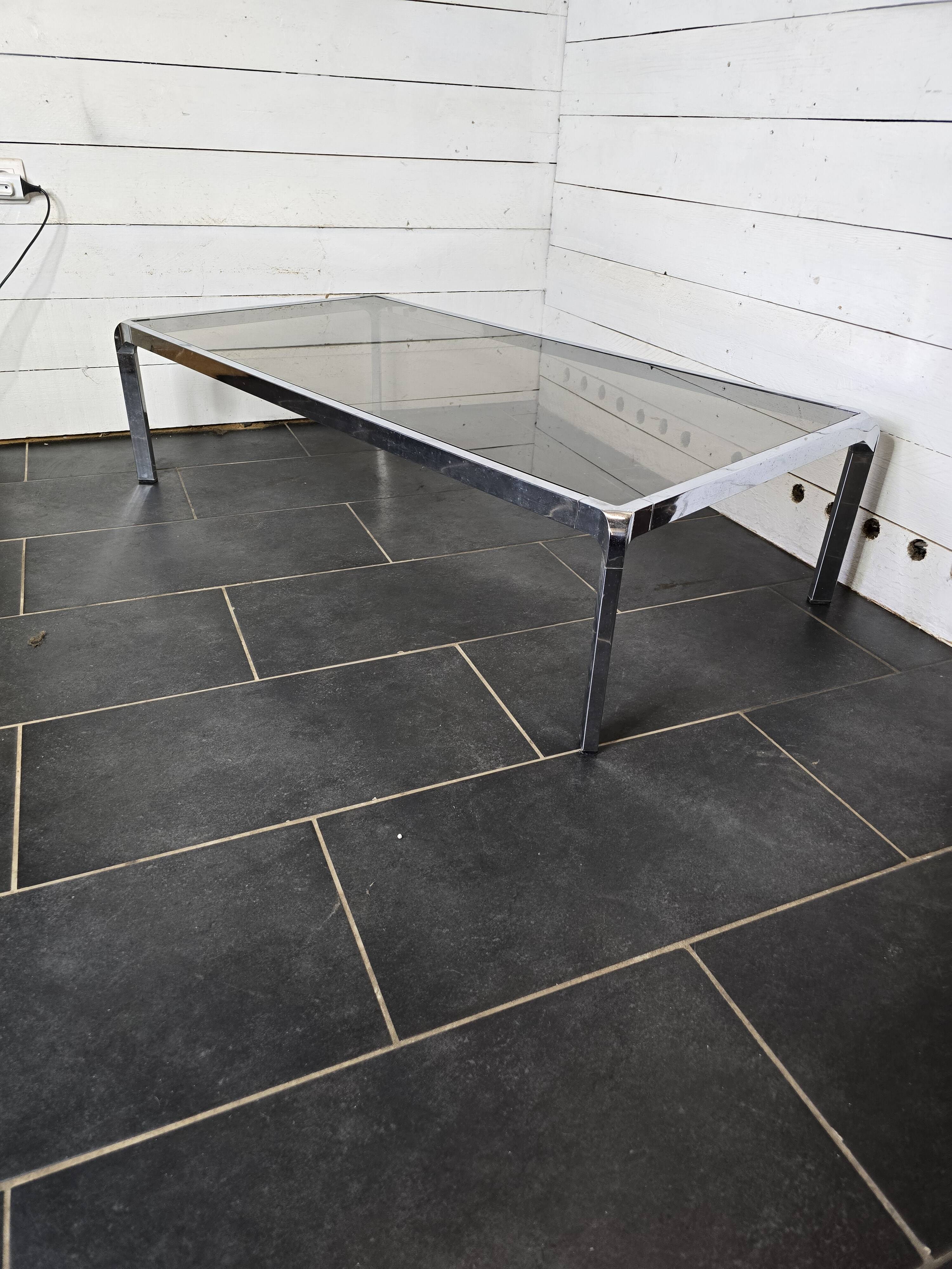 Chromed metal coffee table with smoked glass top from the 70s