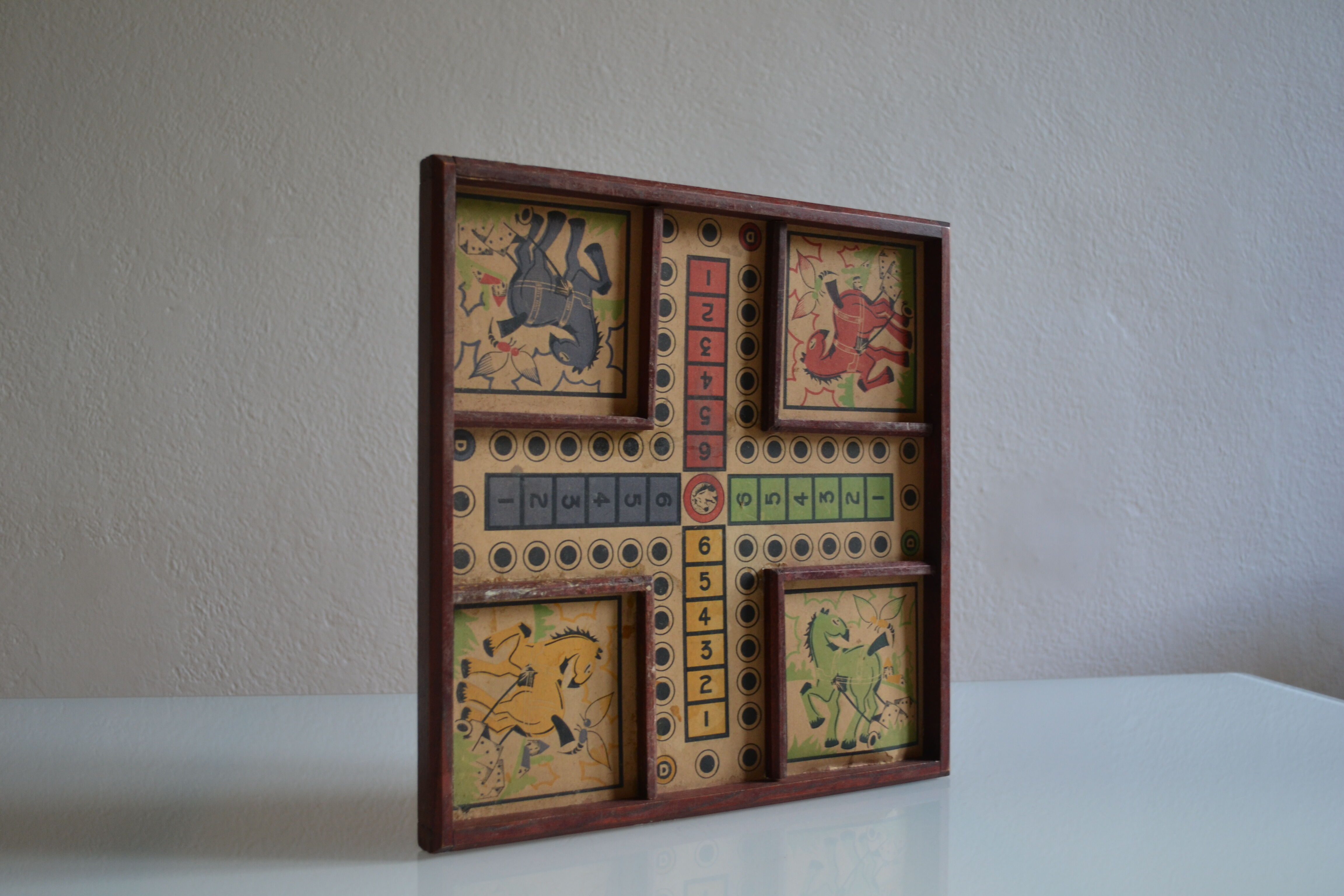 Old game board of small horses