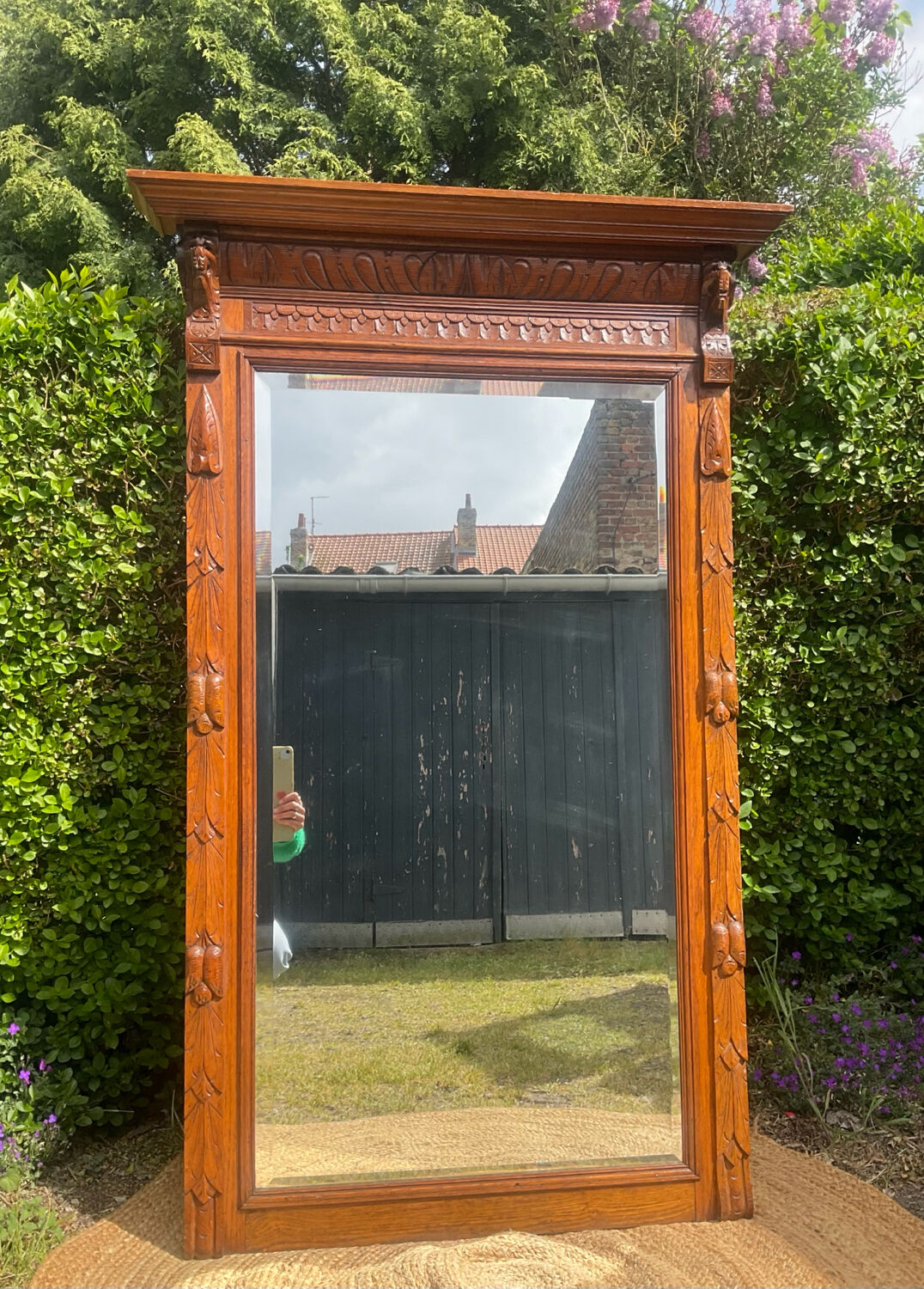 Antique large trumeau mirror in solid wood and bevelled glass.