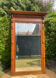 Antique large trumeau mirror in solid wood and bevelled glass.