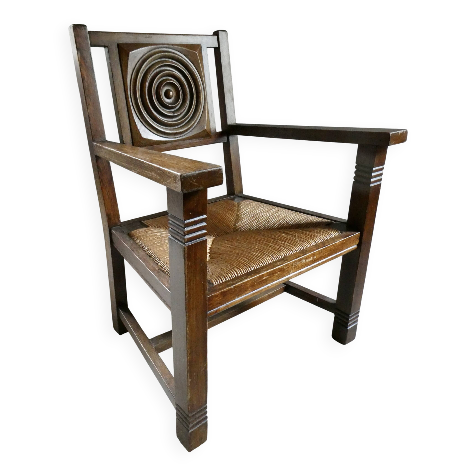 Armchair in carved solid wood with straw seat