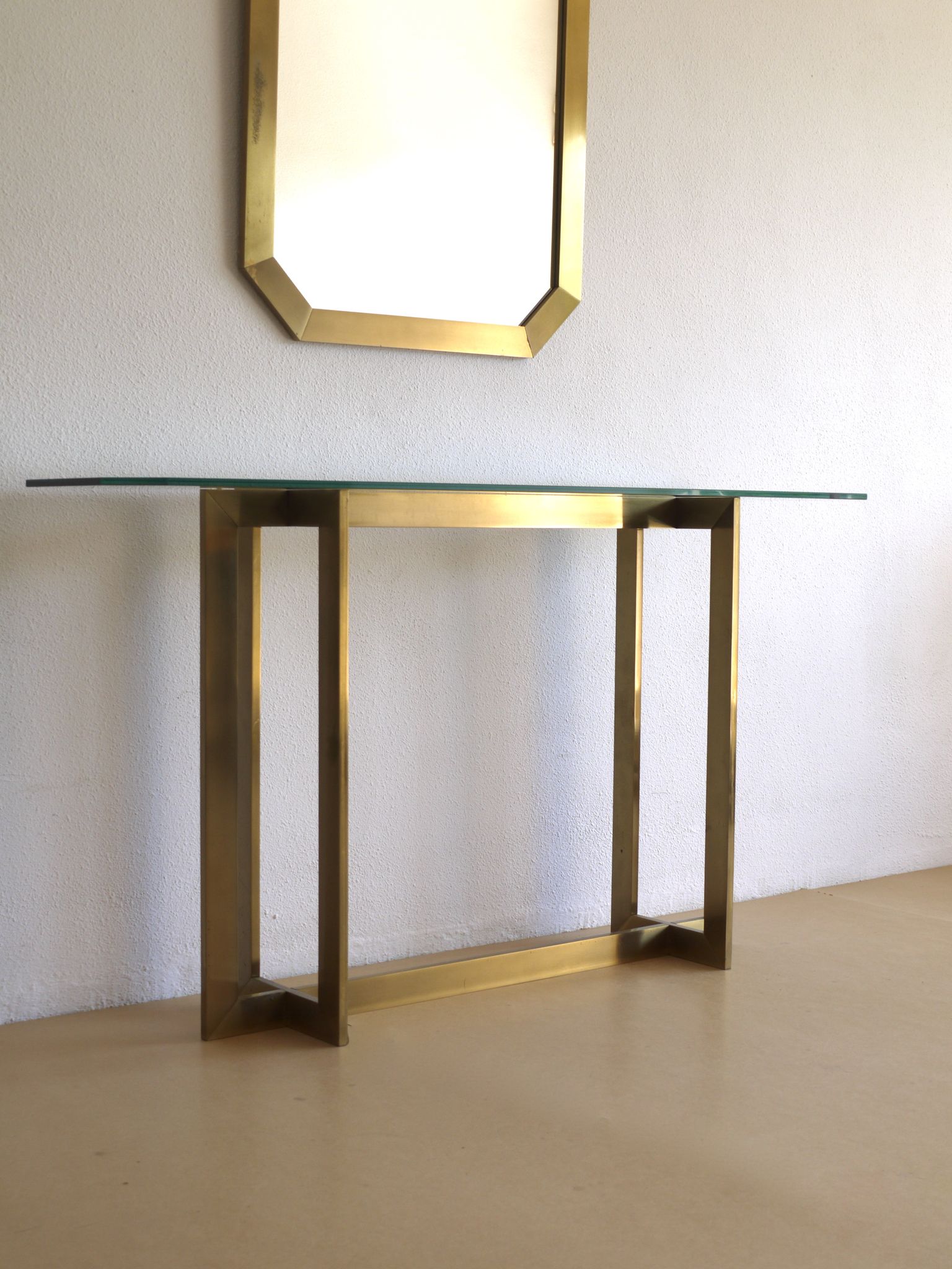 Modernist brass and glass console table & mirror. 1970s