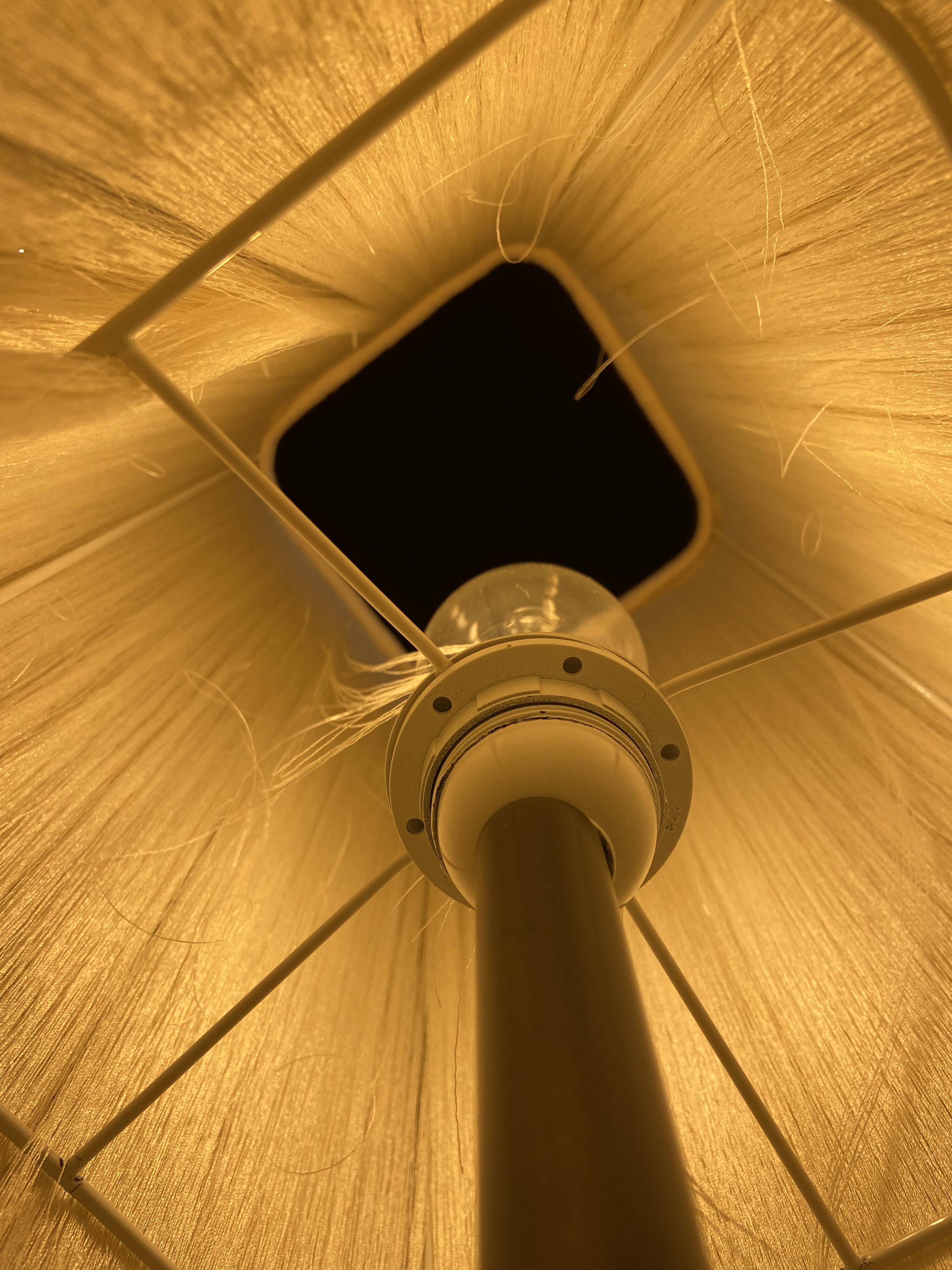 Beige marble stucco base, Houles white ecru fringed lampshade.