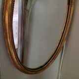 Miroir médaillon en bois doré - 43x24cm