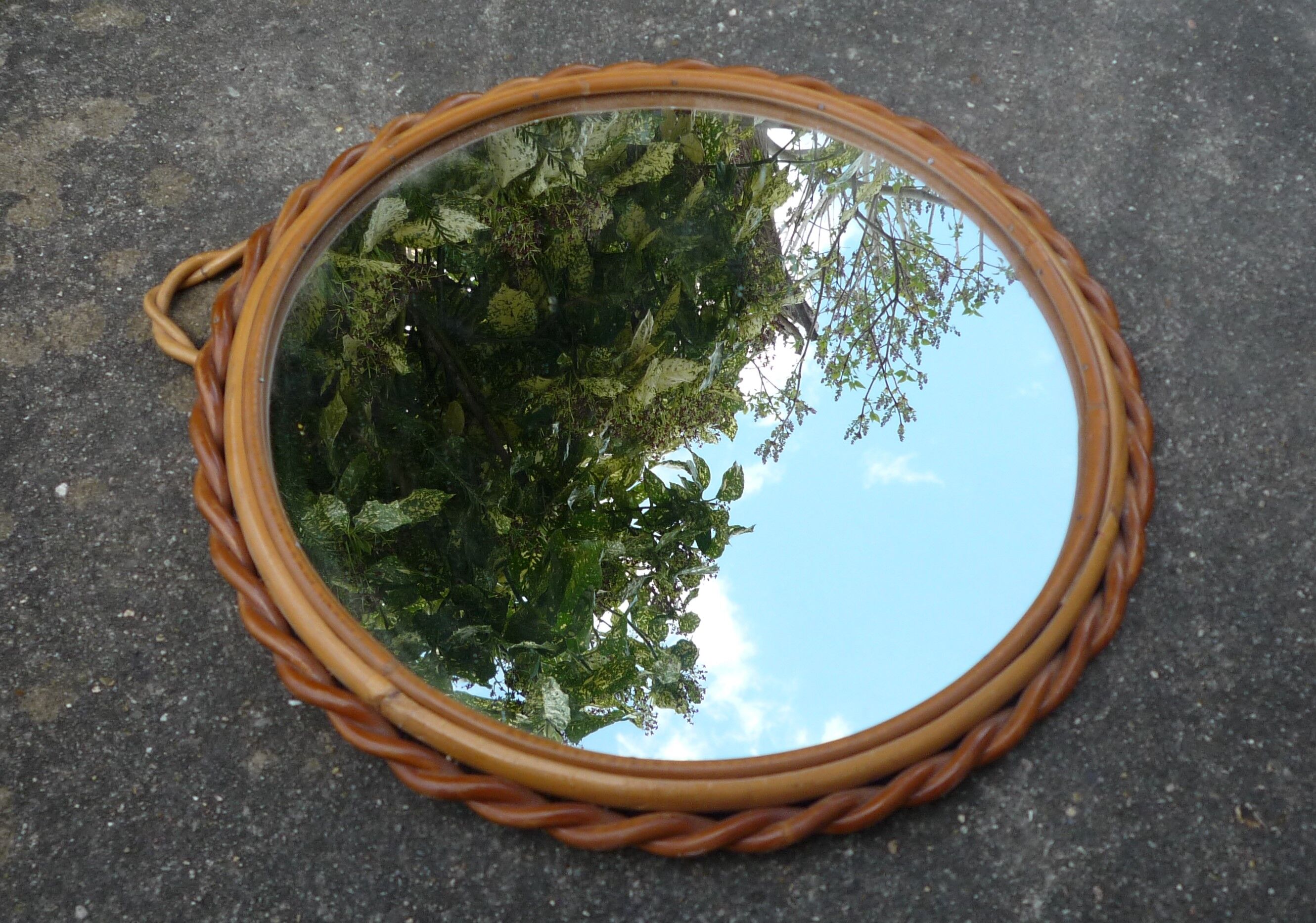 Small round mirror with rattan frame, vintage 70s
