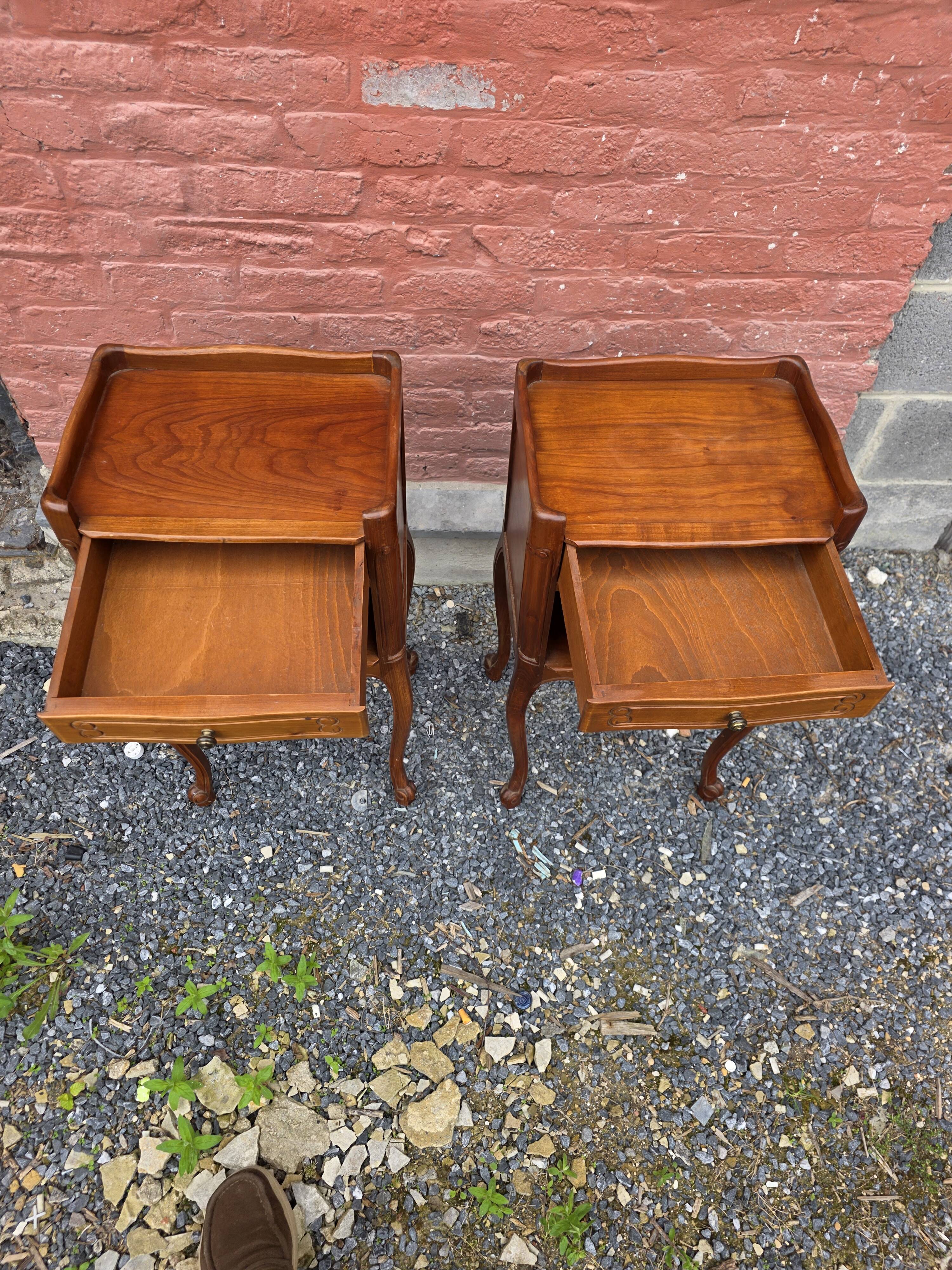 Pair of Louis XV style bedside tables in cherry wood.
