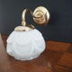 Brass wall lamp and white glass globe from the 1950s-1960s.