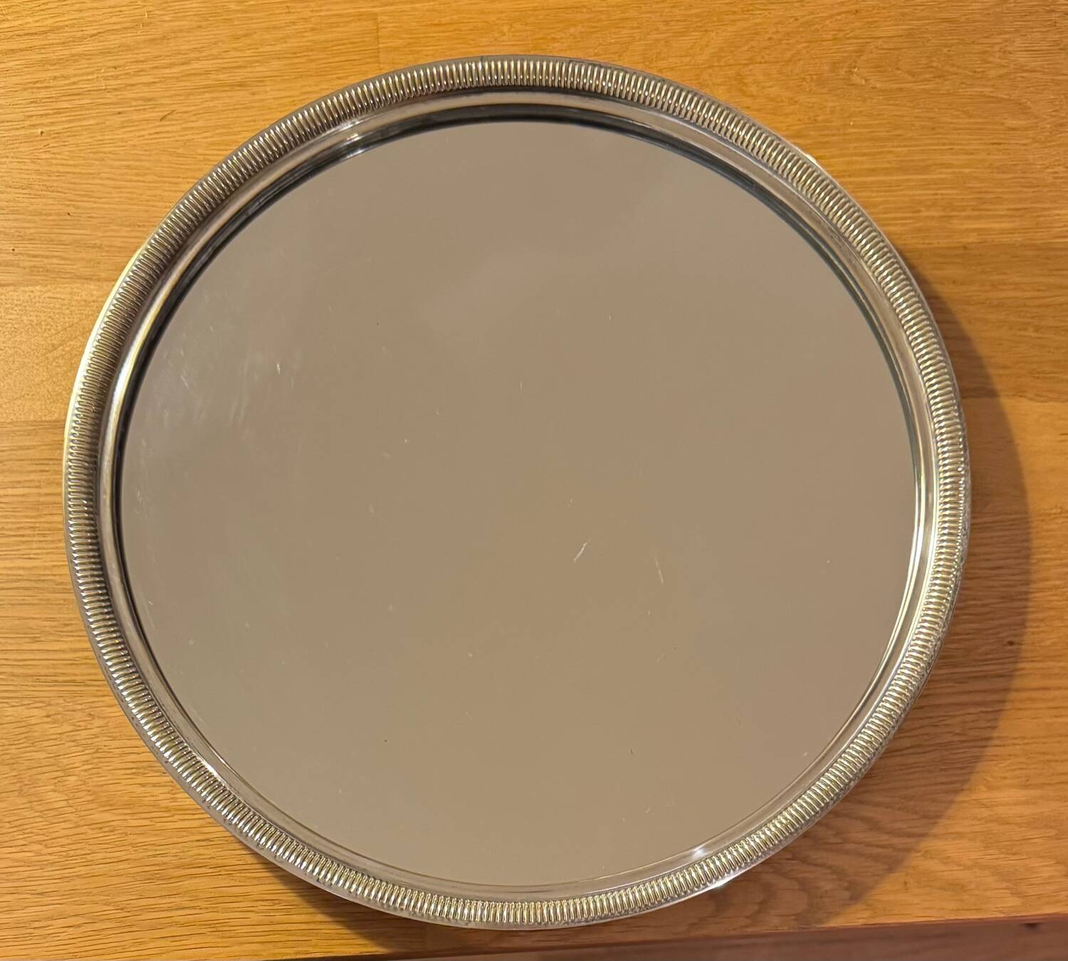 Round silver-plated metal tray and mirror