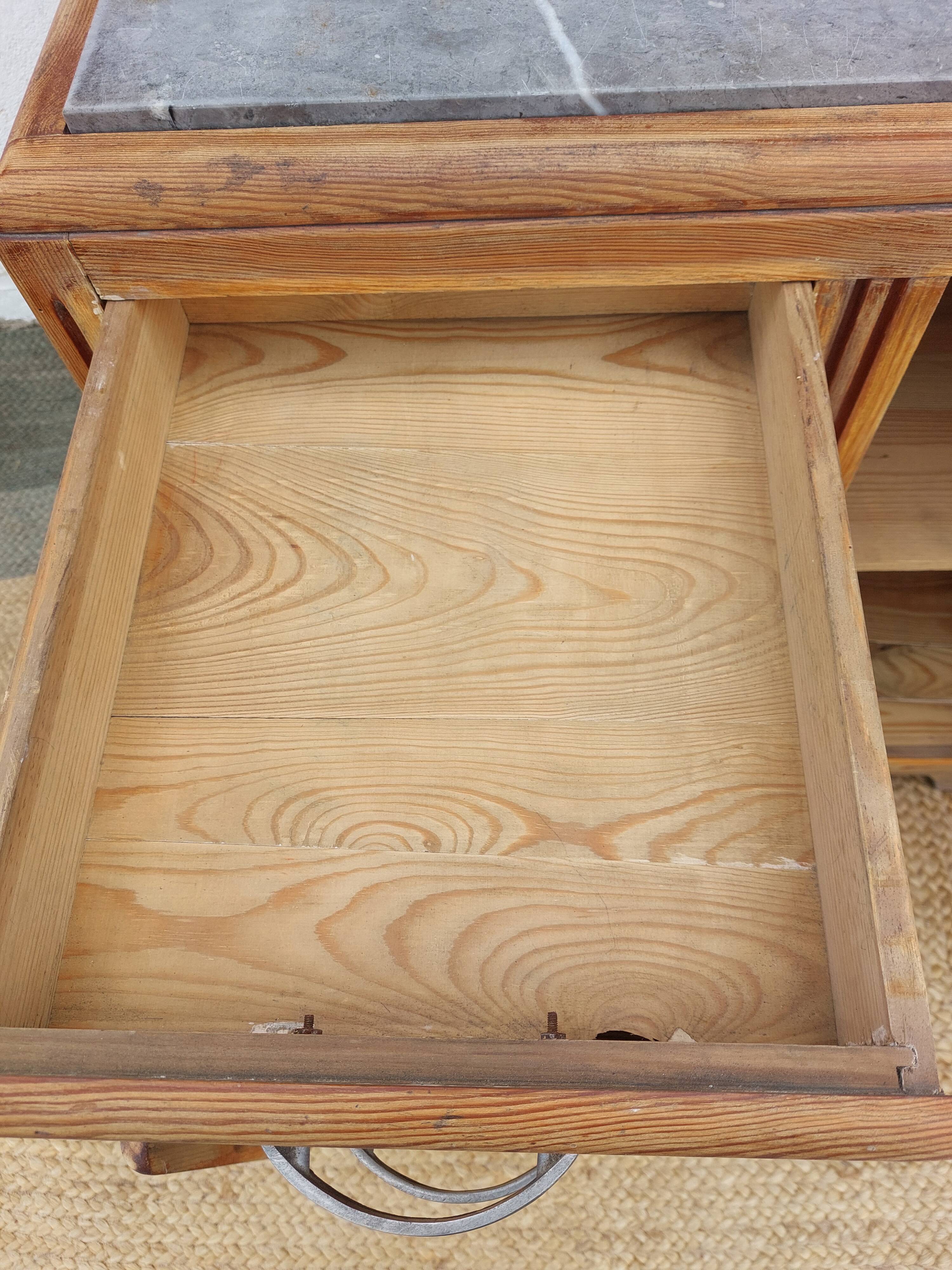 Vintage wooden buffet with a marble top.