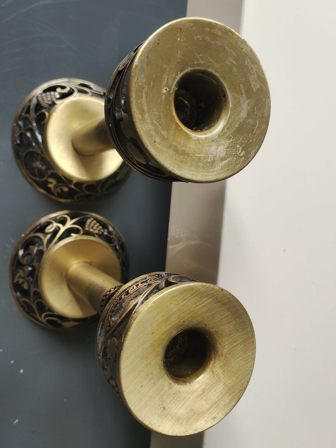 Pair of Hebrew Candlesticks. In antique gold-plated brass. Signed FFS Israel