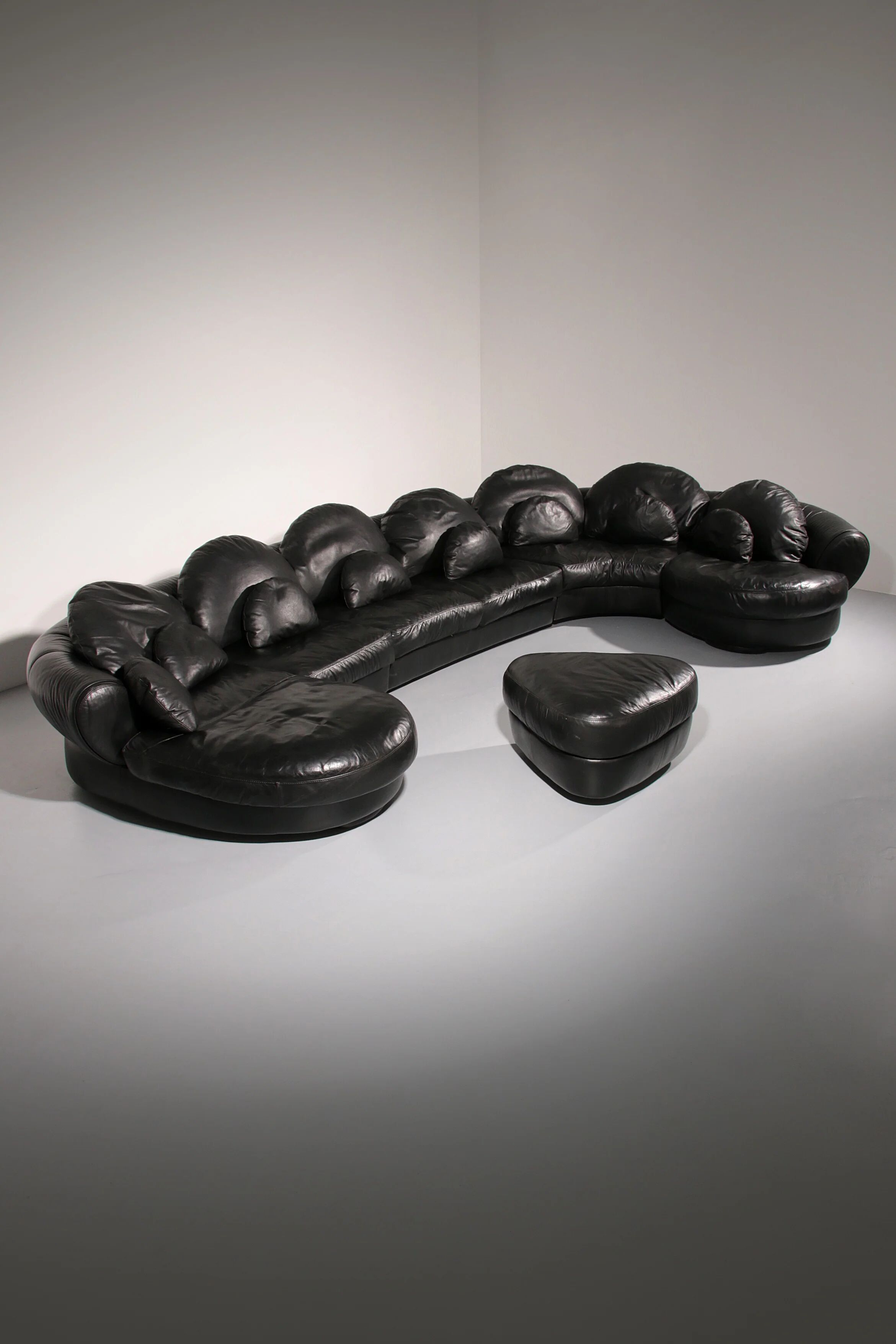 Organically shaped post-modern sectional sofa in black leather