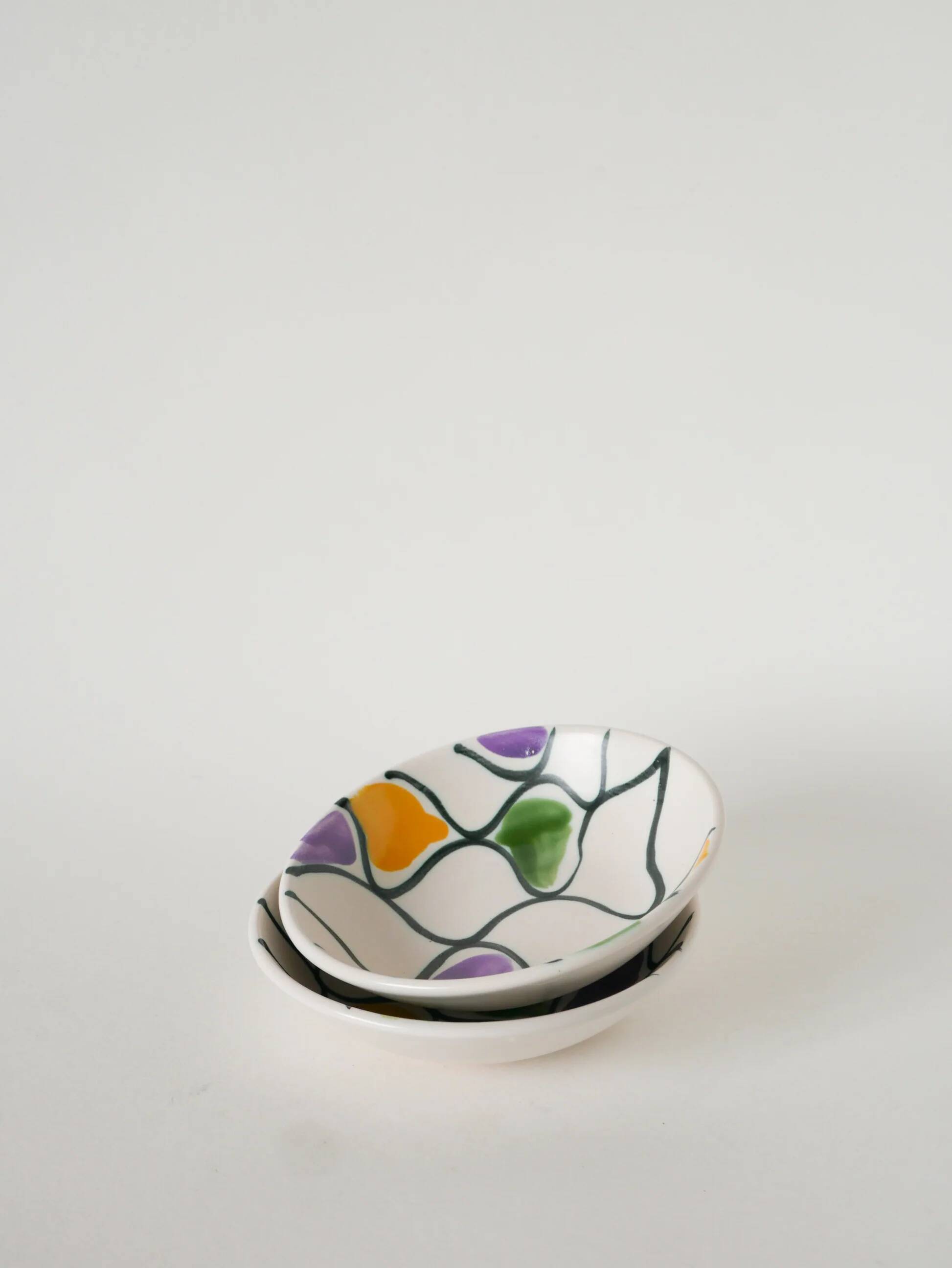 Pair of ceramic ramekins, abstract patterns in yellow, purple and green, Pornic model, 1960.