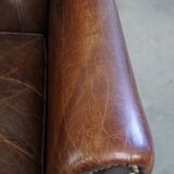 Classic grained cognac colored cowhide leather Chesterfield armchair
