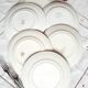 Old mismatched earthenware dinner plates accompanied by a deep dish