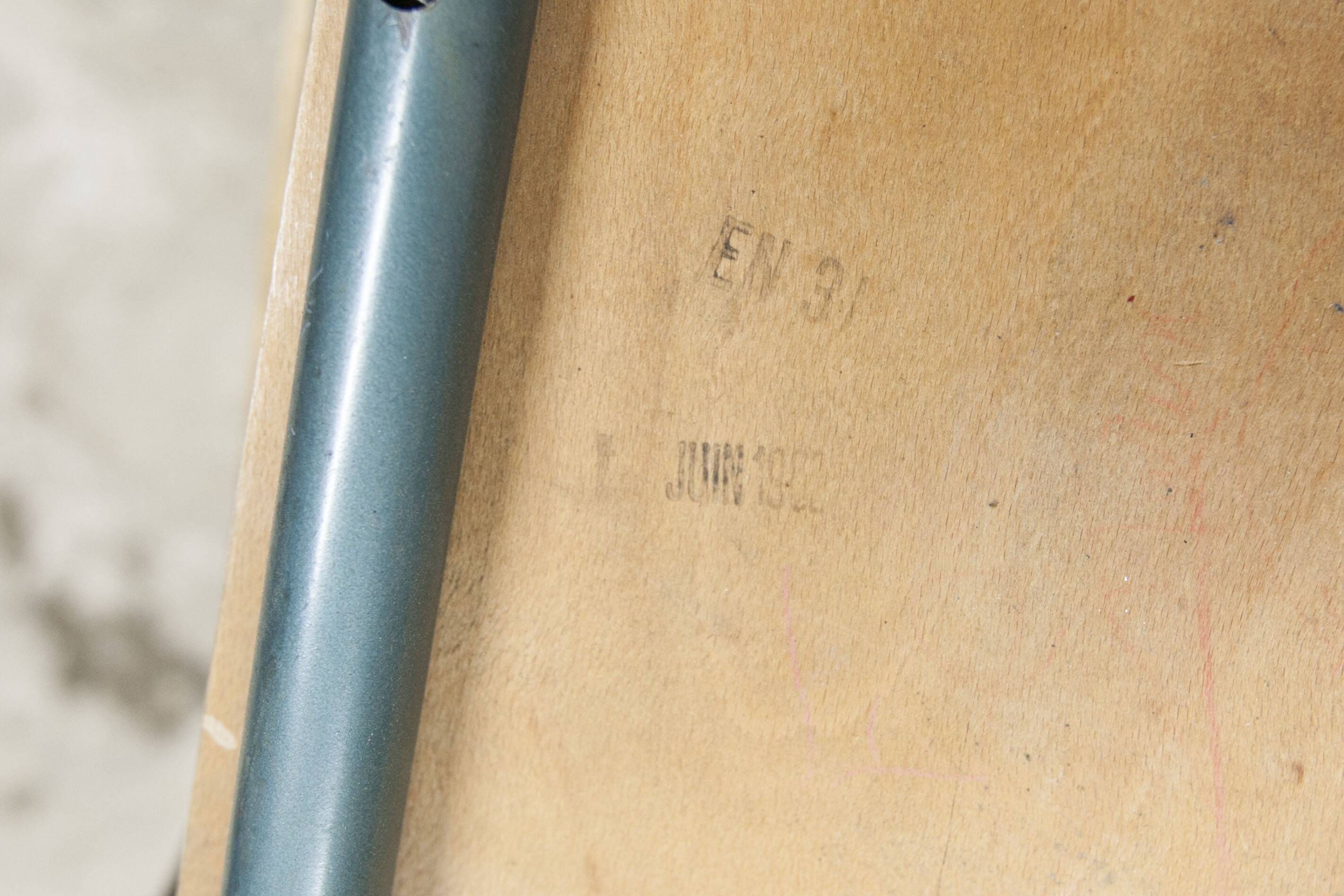 1962 school teacher's chair in honey color and tubular structure