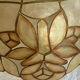 Large mother-of-pearl and brass chandelier with floral decoration.