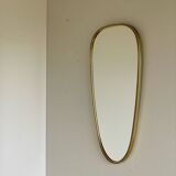 Vintage brass mirror in rear-view mirror shape