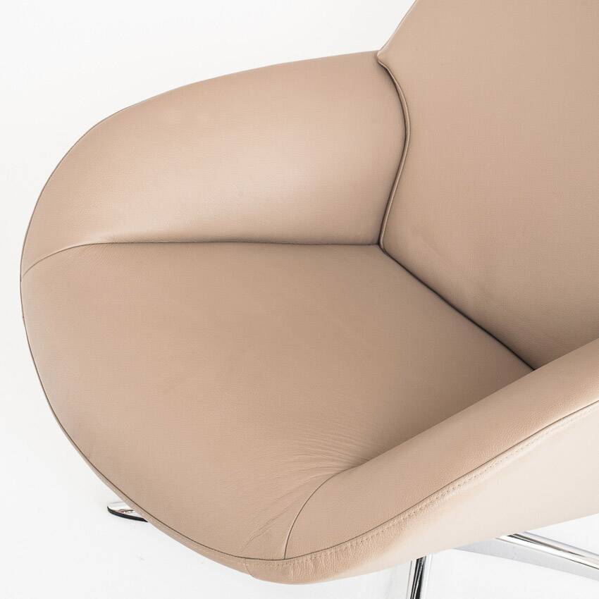 Leather armchair with footstool. Lotus model. Manufacturer: Kebe. Denmark