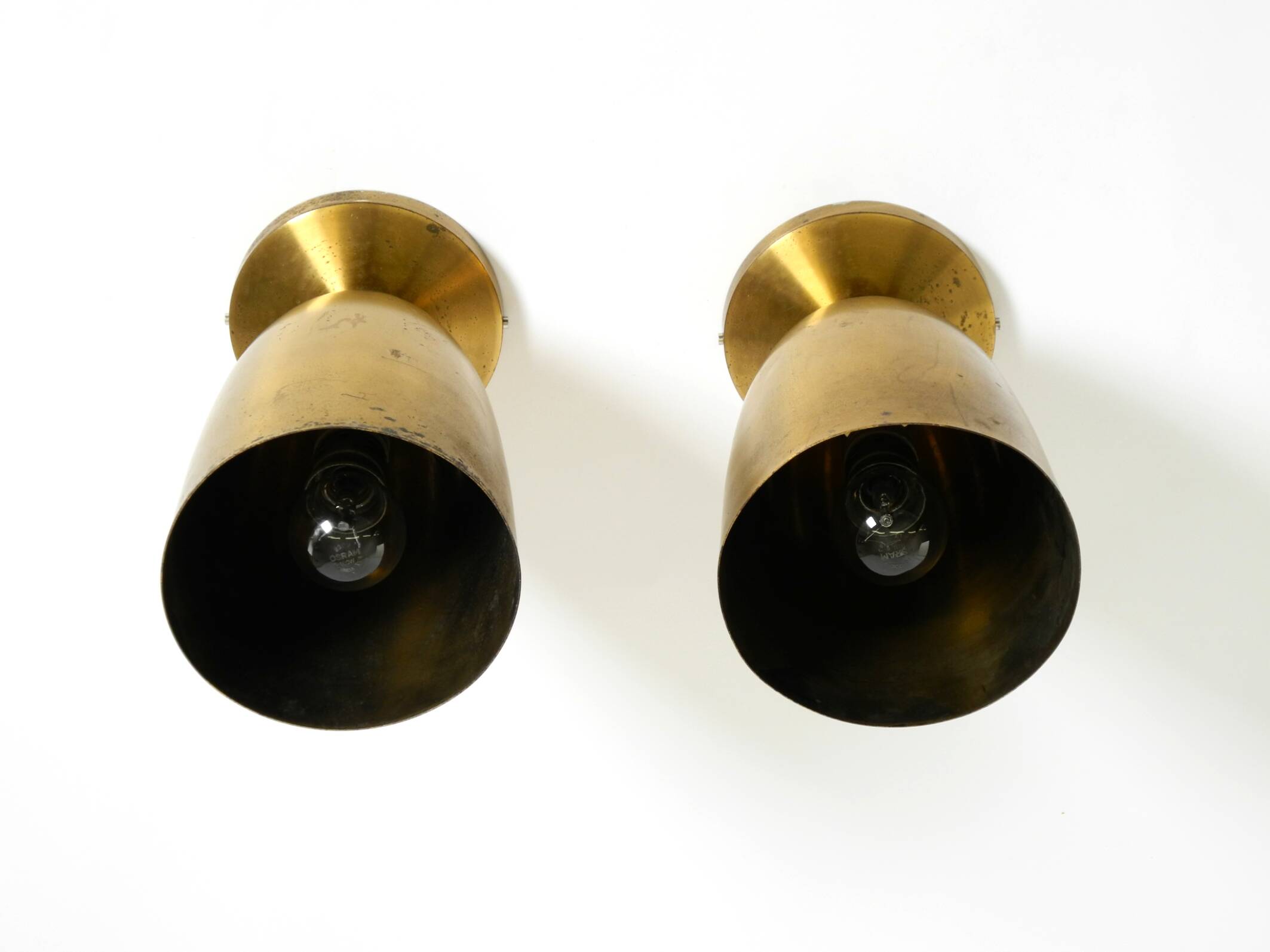 A pair of large, original Mid Century Modern brass ceiling lamps
