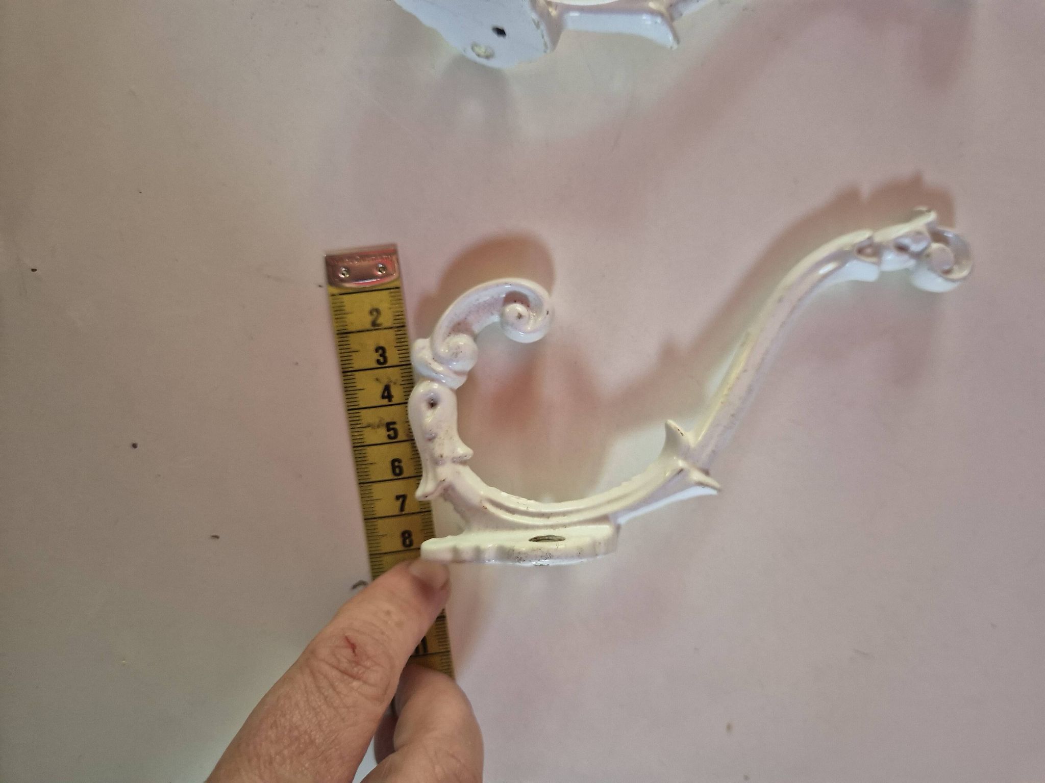 set of 2 vintage white cast iron hooks, small paint chips from the year