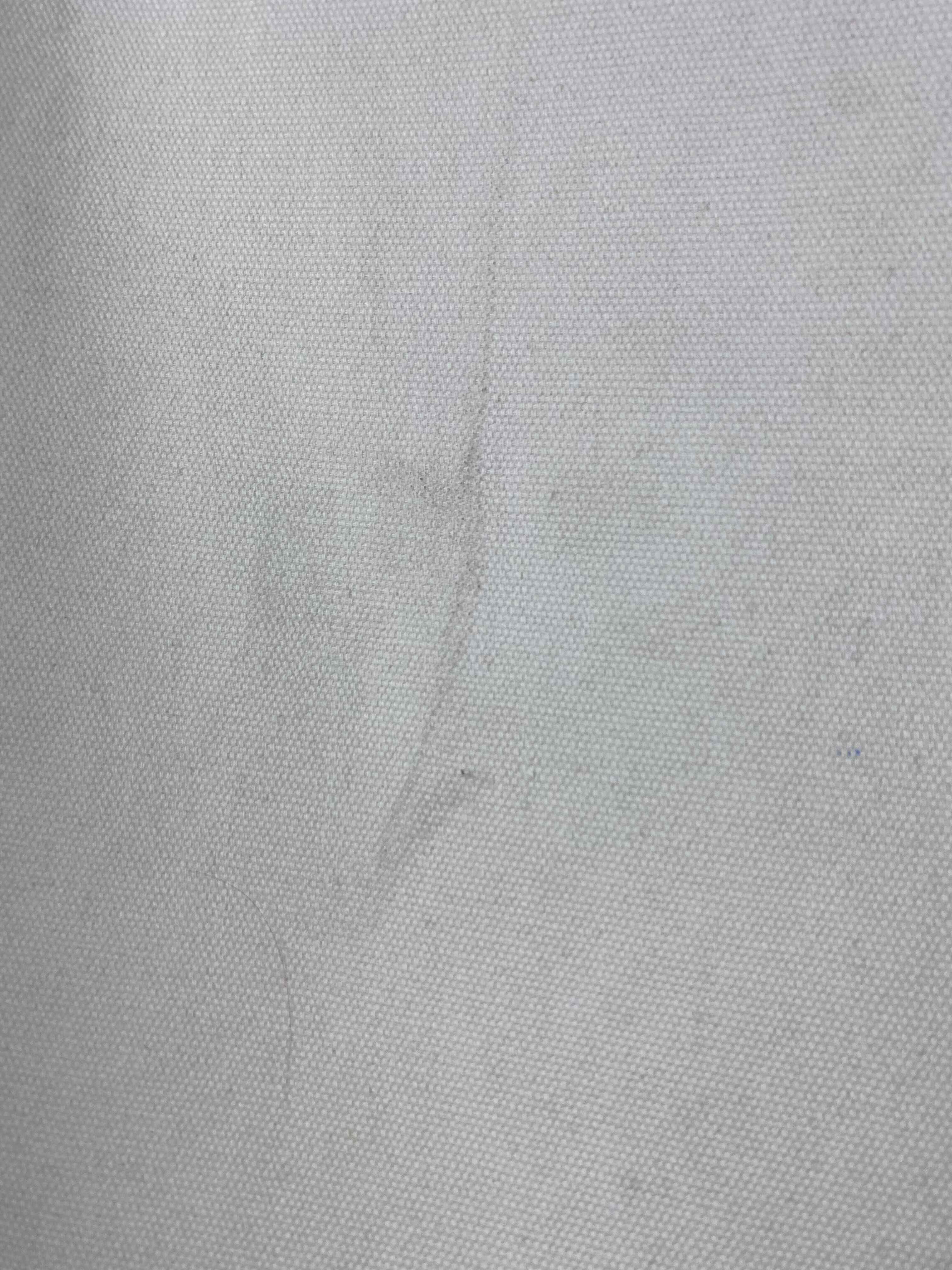 White fabric deckchair with wooden structure