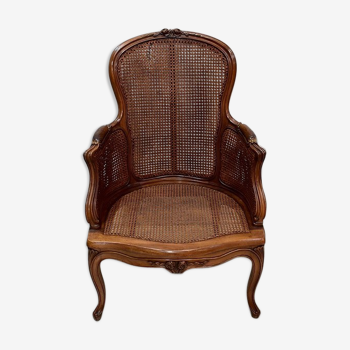 Bergère cannée en noyer massif, style Louis XV fin XlXe