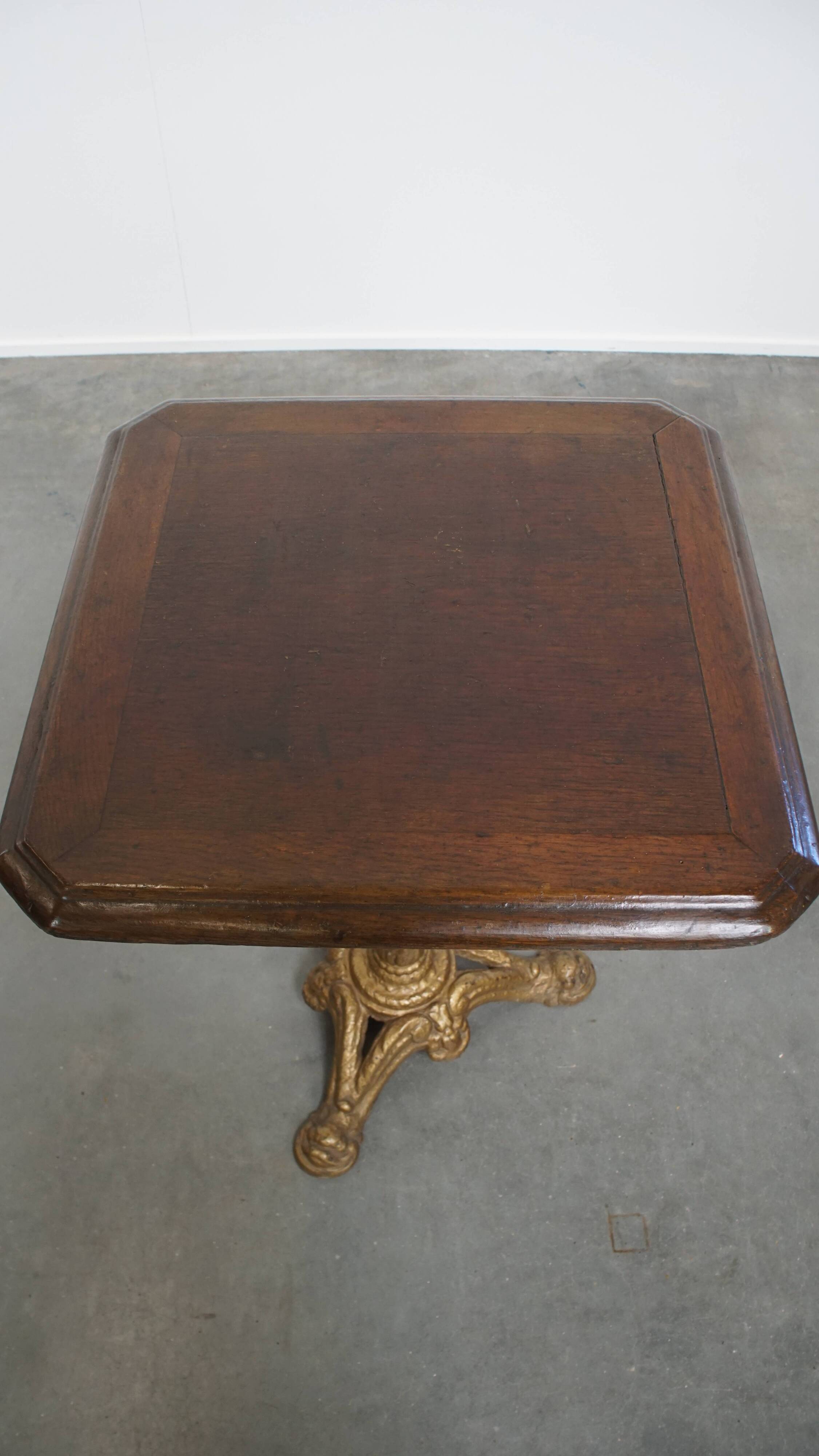 Antique Bistro Table with Gold-Colored Cast Iron Base and Dark Oak Top