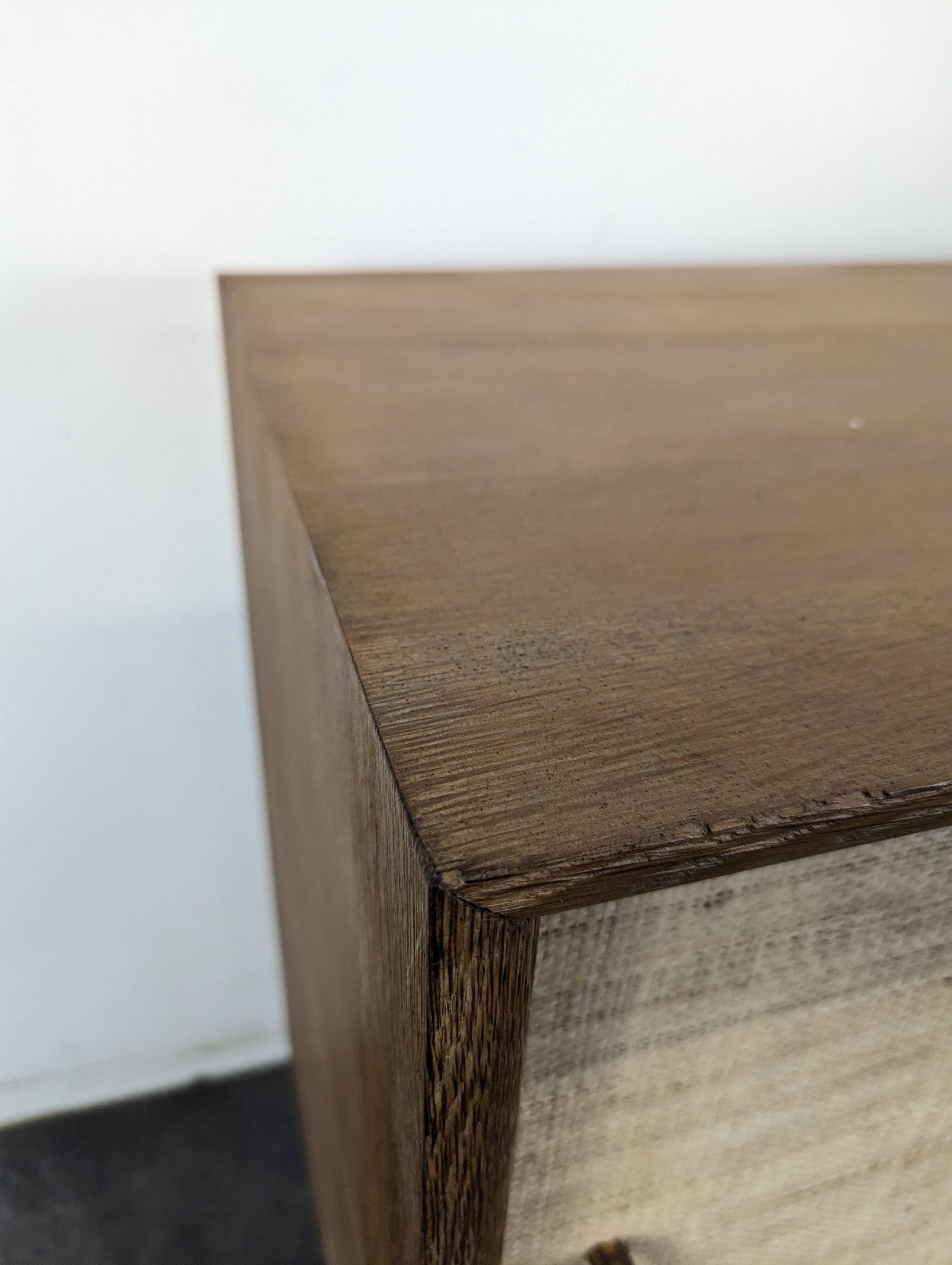 Modernist sideboard in oak with rattan doors.