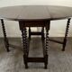 Ancienne table pliante anglaise en bois et pieds tournés 