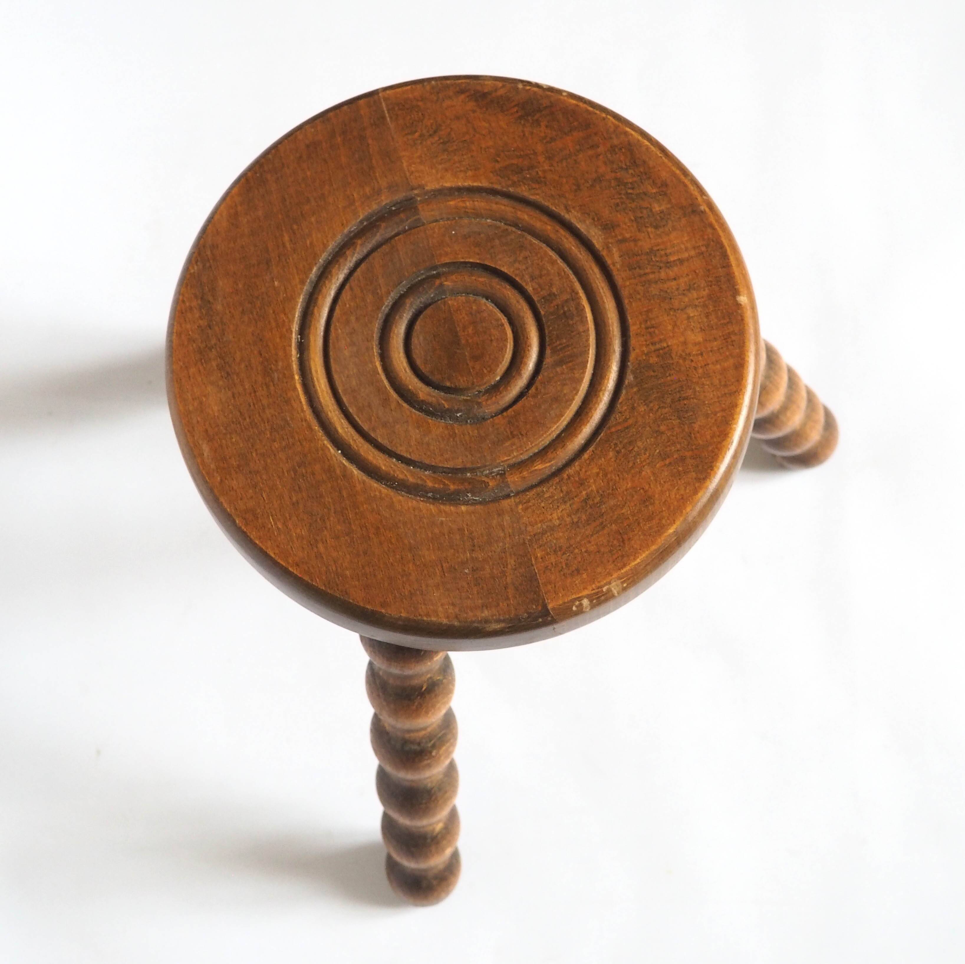 Beaded wooden tripod stool