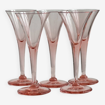 5 pink translucent glass cocktail flutes.