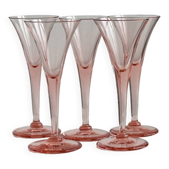 5 pink translucent glass cocktail flutes.
