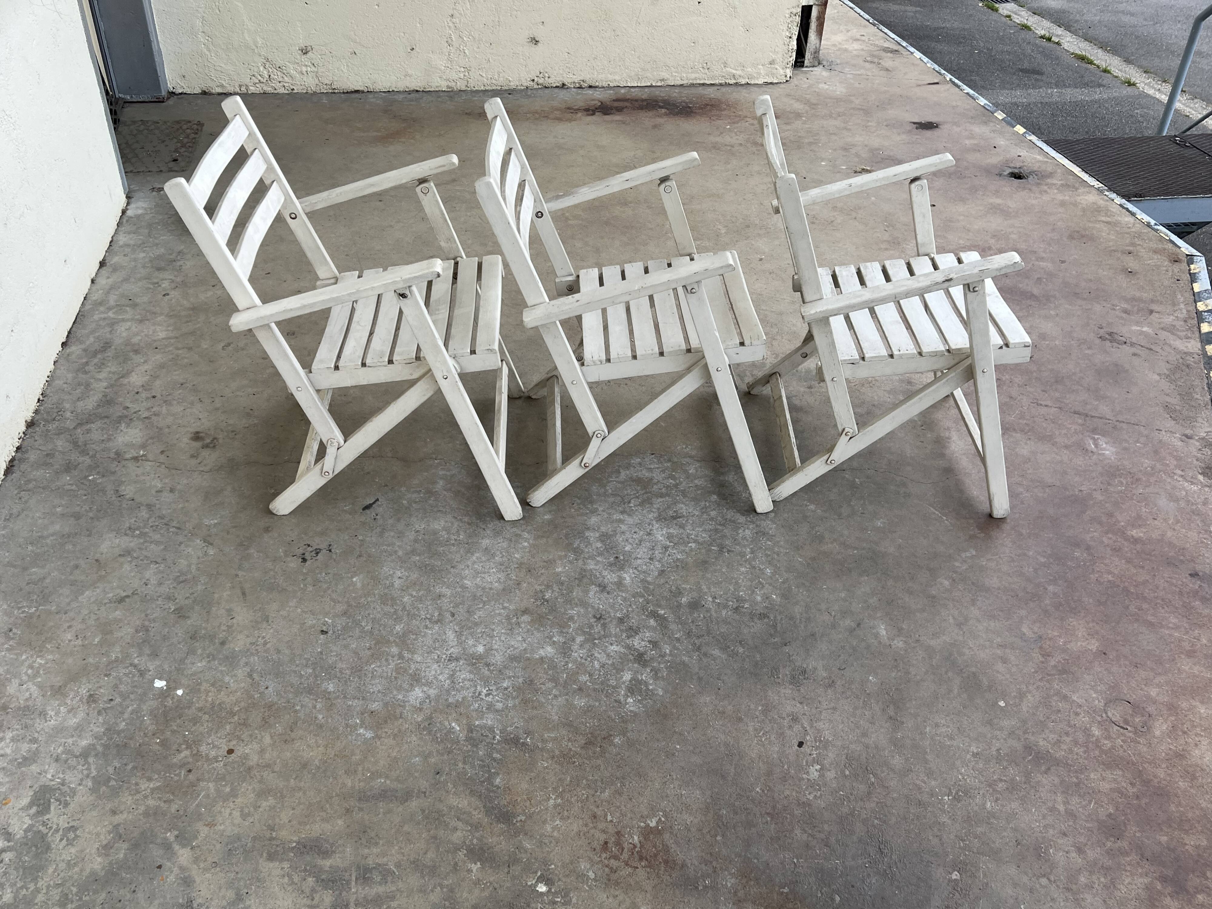 Folding wooden armchairs