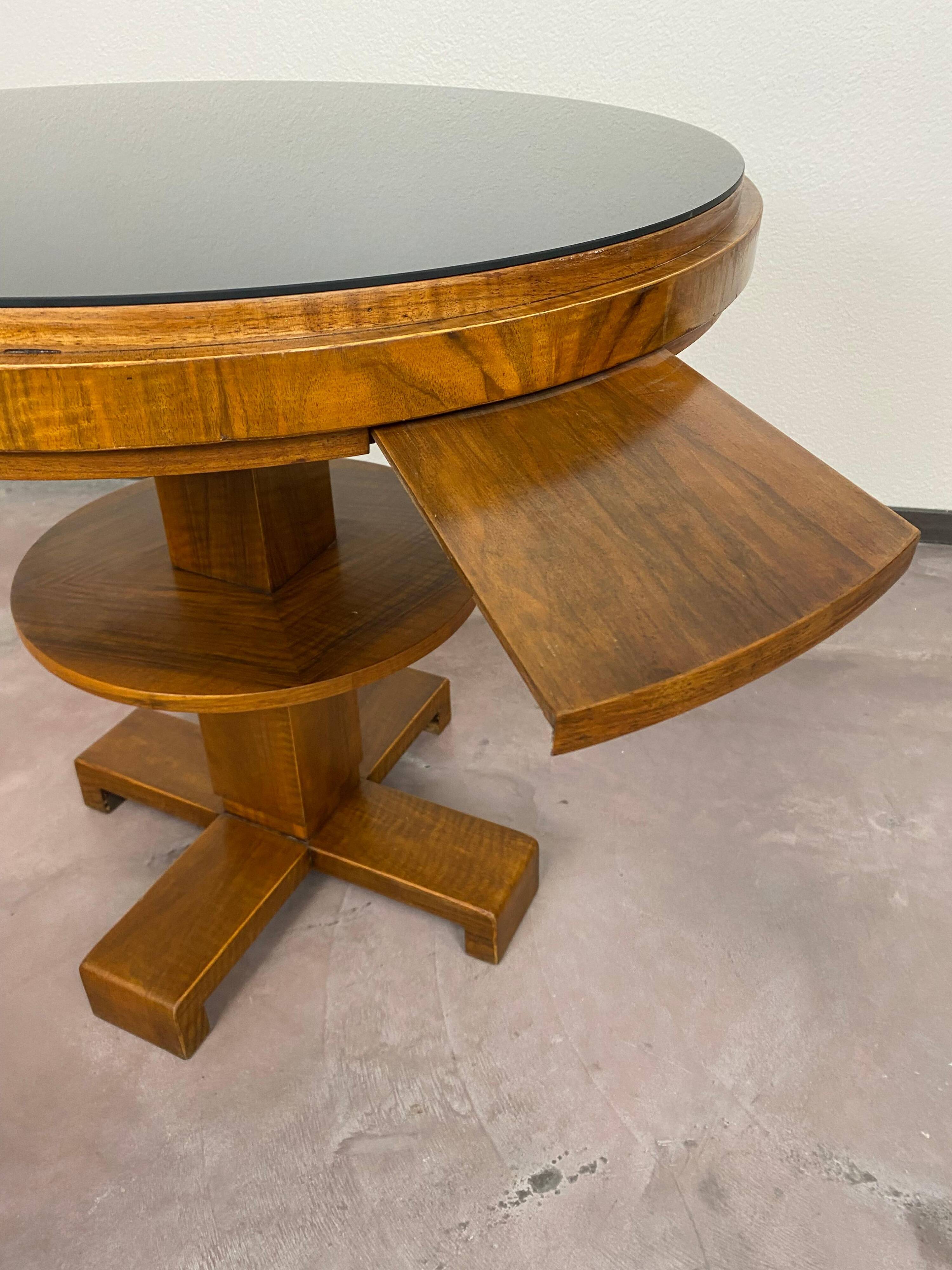 Art Deco game table with a black glass top.