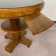 Art Deco game table with a black glass top.