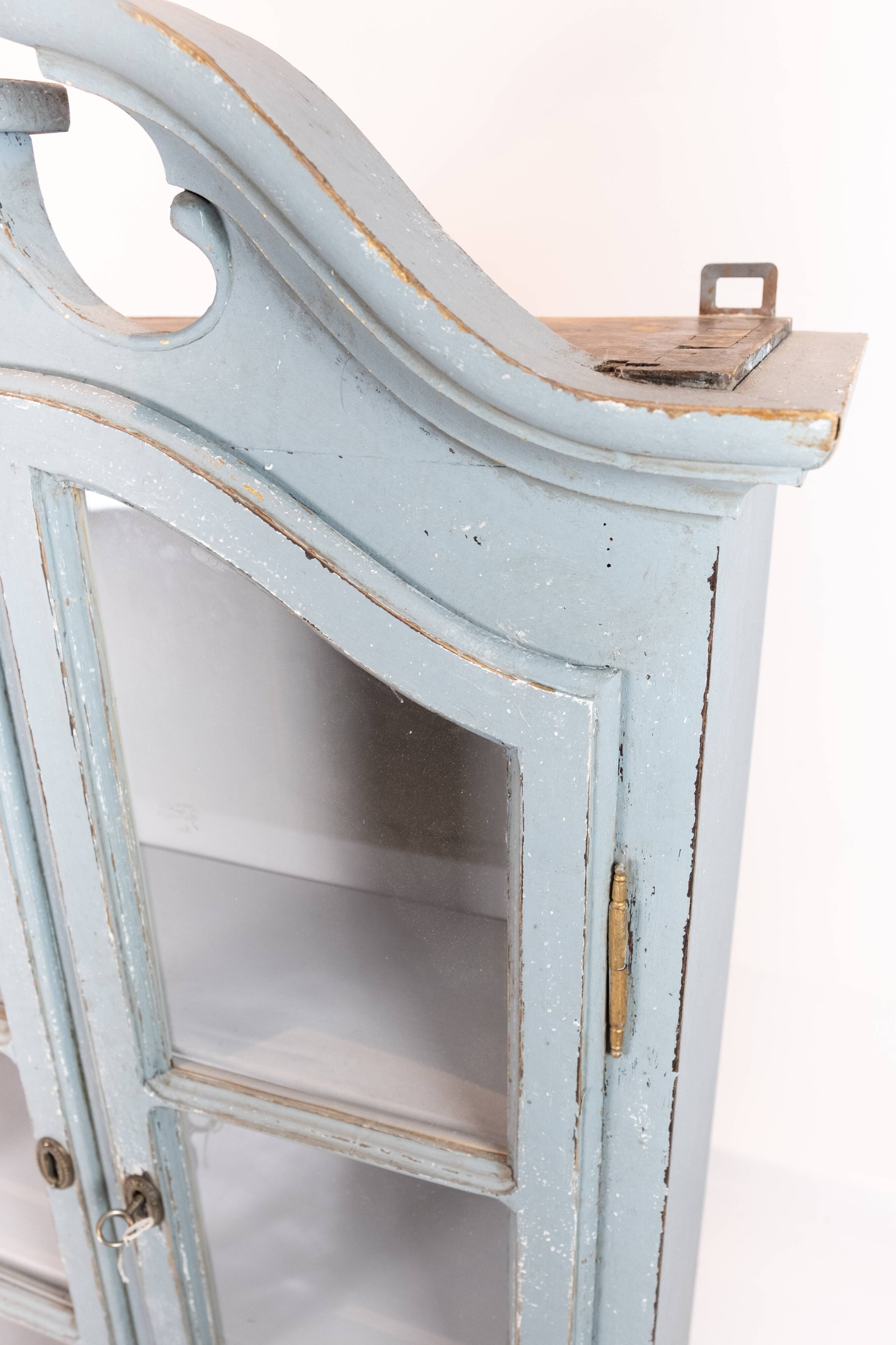 Grey painted hanging glass cabinet in gustavian style from around 1820.