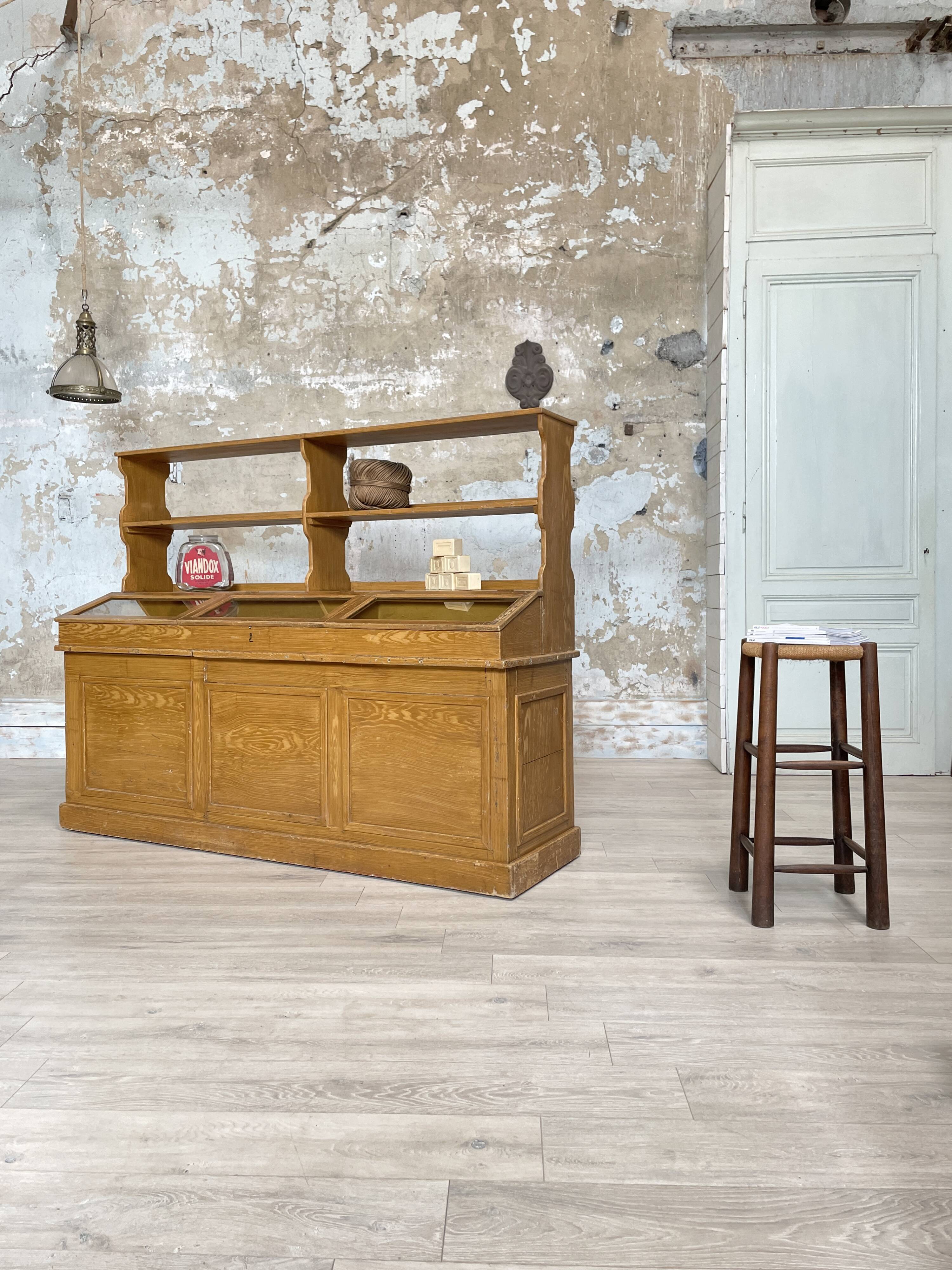 Wooden hardware cabinet painted with wood effect, circa 1940.