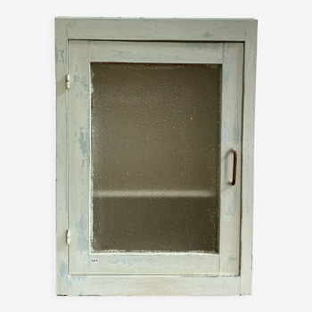 Old medicine cabinet in mint green patinated wood
