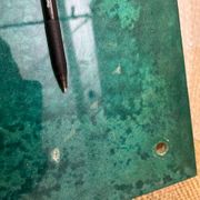 Aldo Tura side table in aqua green with brass legs and lower drawer.
