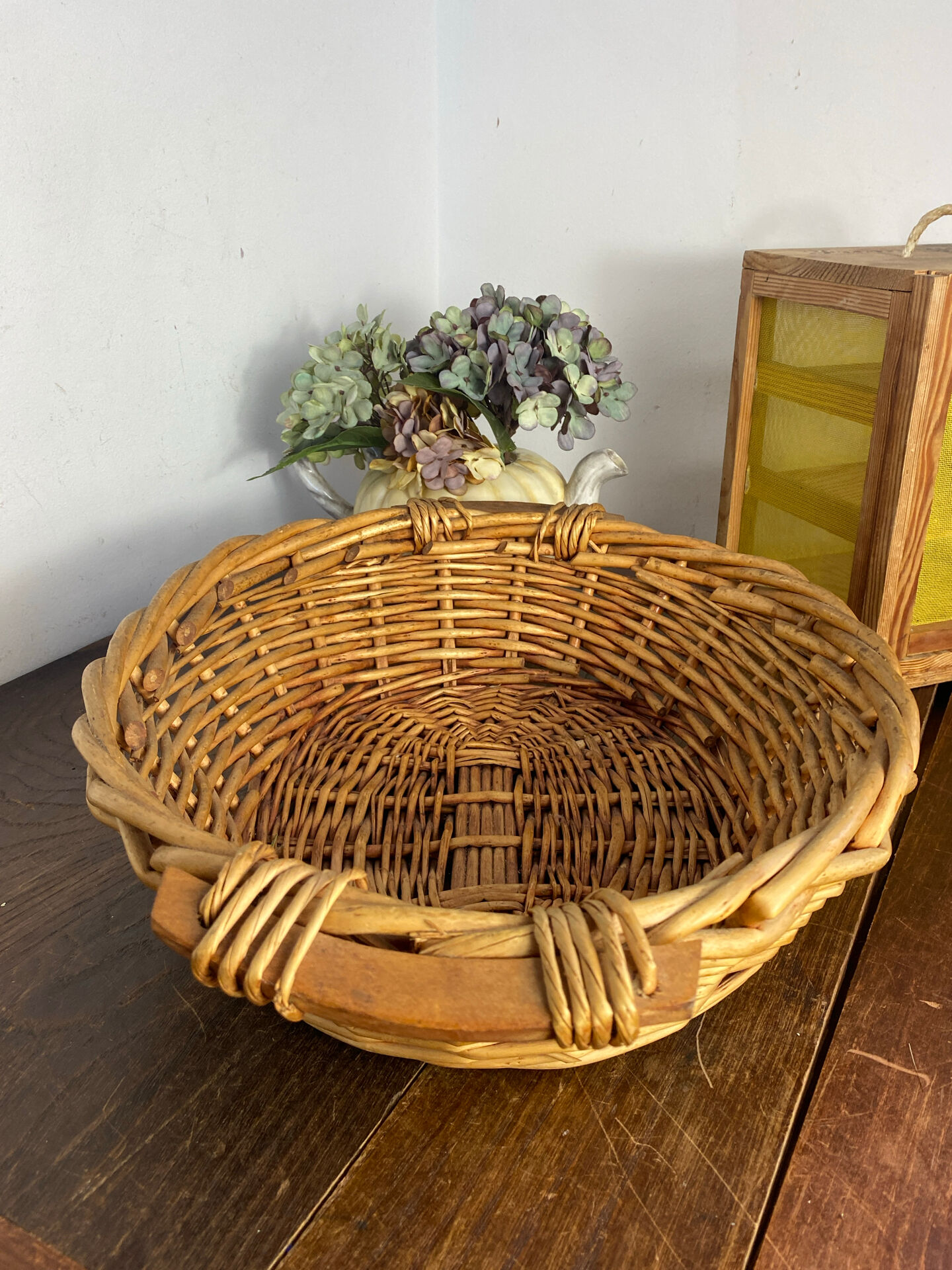 Wicker basket with wooden handles