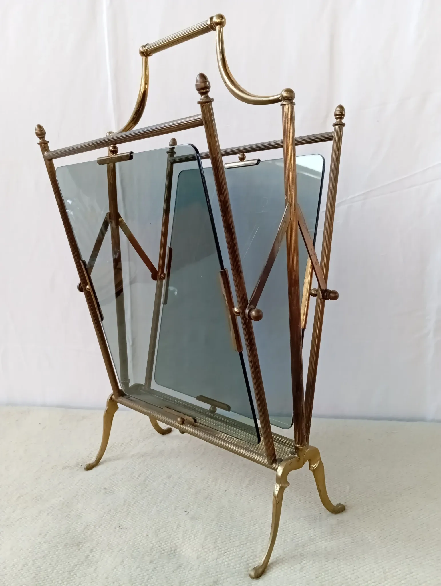 Neo-classical brass magazine rack in the spirit of Maison Jansen.