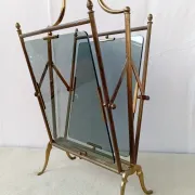 Neo-classical brass magazine rack in the spirit of Maison Jansen.