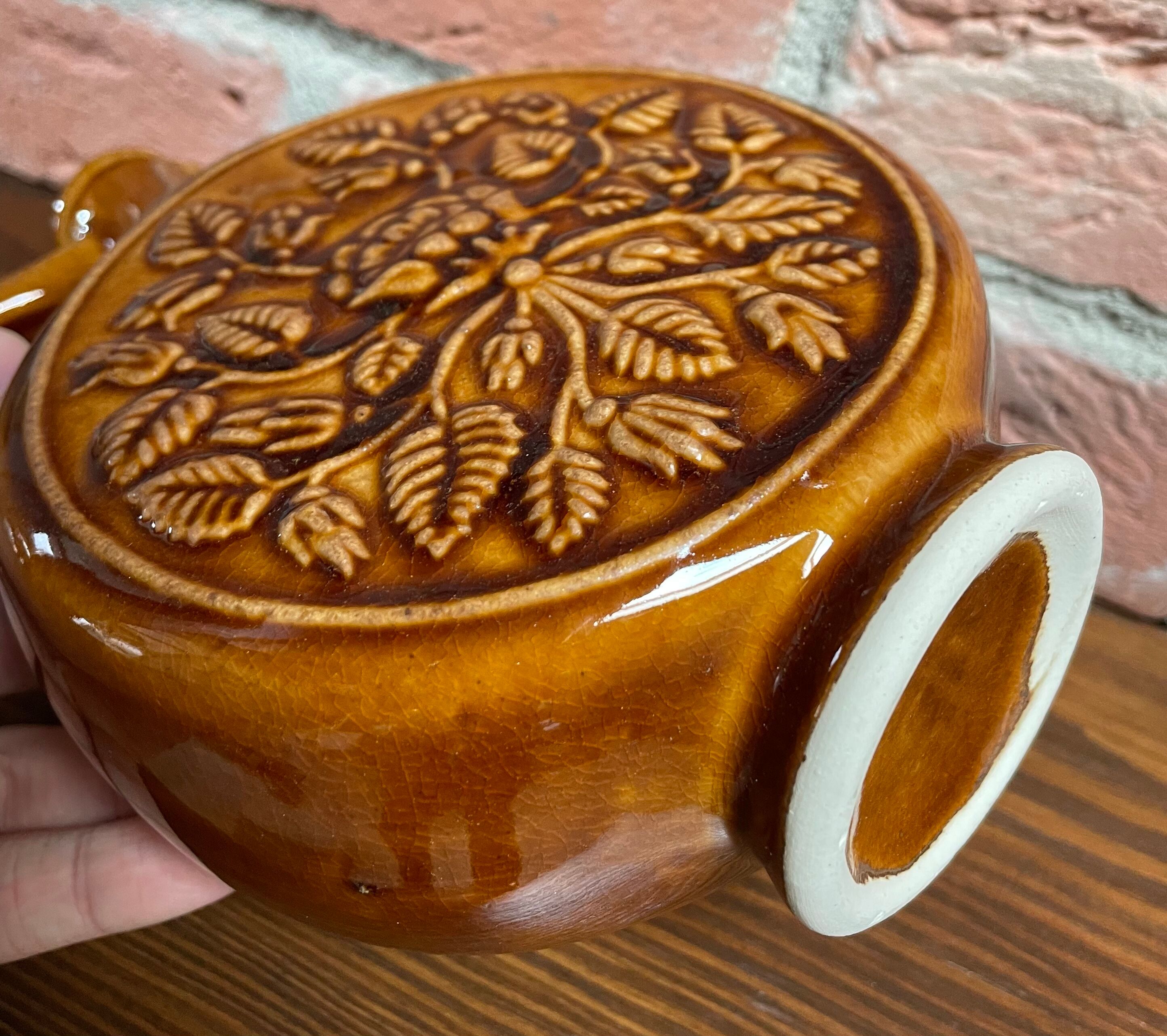 German round vase with floral motif, ornamental brown ceramic jug with handle