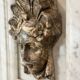 Female mascaron in grey Ardennes marble from the Regency period, 18th century.