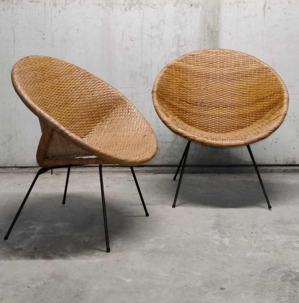 Pair of braided rattan armchairs