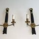 Pair of black lacquered bronze wall sconces decorated with lion heads