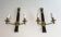 Pair of black lacquered bronze wall sconces decorated with lion heads