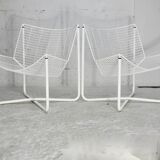 Paire de fauteuils tiges d'acier laqués blanc. Circa 1985