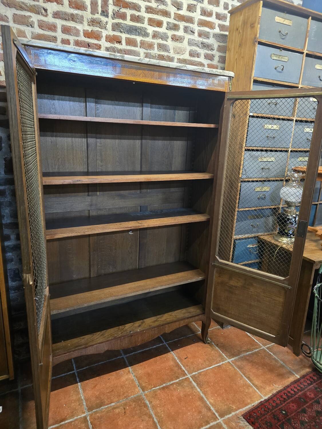 Marquetry bookcase with marble top
